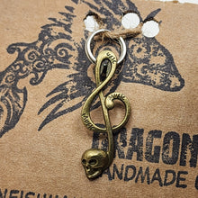 Load image into Gallery viewer, Large Brasstone Skull Treble Clef Zipper Pull
